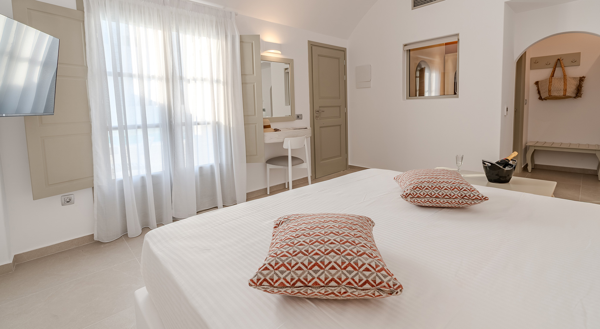 Bright interior of the Signature Double Room at Antoperla Adults Only Santorini Hotel