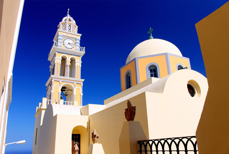 Christian church with dark blue domes of white color against the
